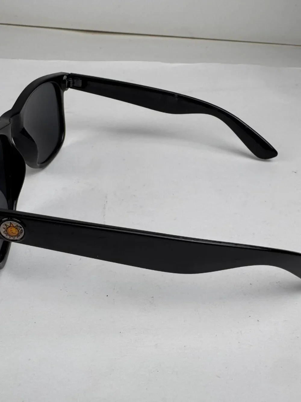 Black Wayfarer Style Sunglasses Smiling Sun Logo UV Protection (Minor Scratches)